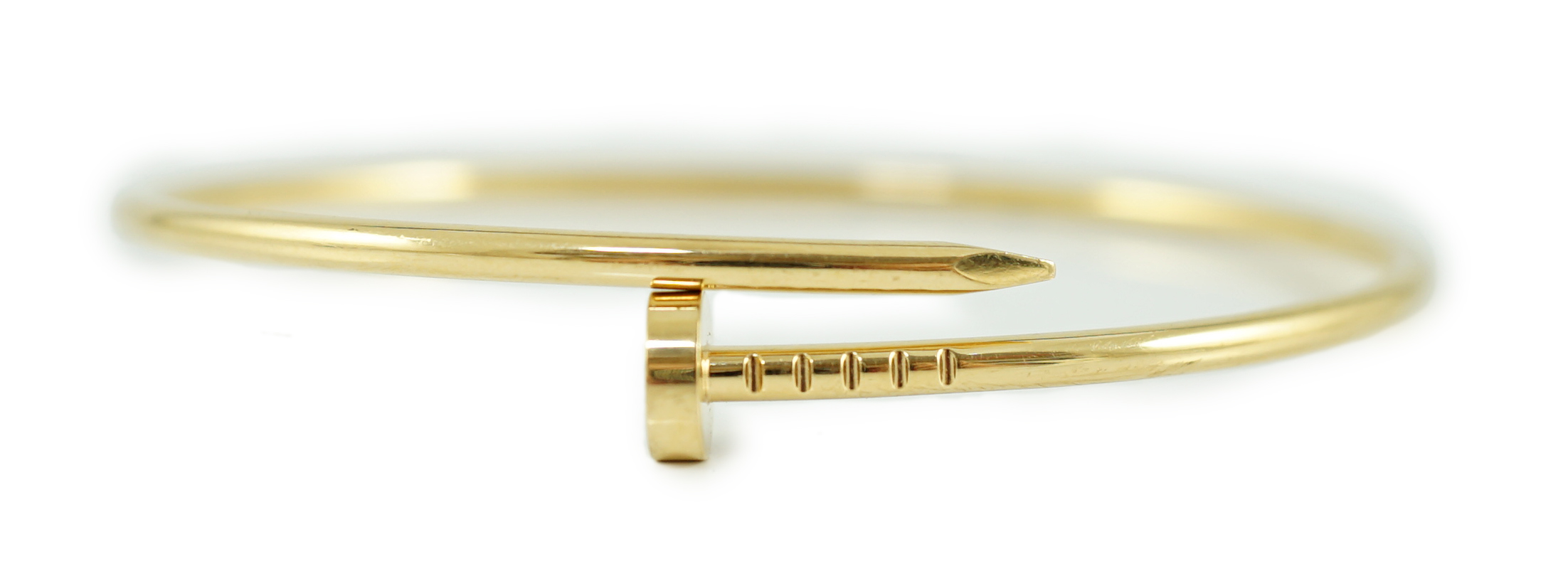 A modern 18ct gold Cartier Juste Un Clou bangle